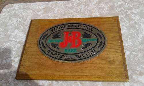 Justerini and Brookes Brass enamel plague on wood Bartenders Club